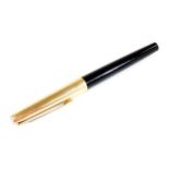 A Pelikan 30 fountain pen, in black and gilt colours with shaped clip, partially enclosed nib, 13cm