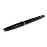 A Montblanc 320 fountain pen, in black with gilt coloured clip and banding, with star top, partiall