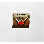 A Pandora charm, in the form of a sealed letter, 'From Me' with red enamel love heart, and 'Top My L
