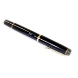 A Pelikan M200 fountain pen, in black and and gilt colours, gilt banding, stamped Pelikan lid, nib s