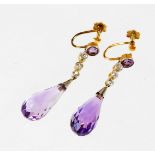 A pair of 18ct gold amethyst and diamond drop earrings, with tear drop shaped amethyst drop and row