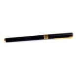 An Aurora Marco Polo fountain pen, in black with gilt coloured banding and clip, open nib, 14cm W.