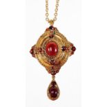 A 9ct gold Victorian style garnet pendant/brooch and chain, the pendant set with two cabochon cut ga
