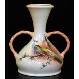 A Royal Worcester Locke & Co two handled blush ivory vase, decorated with a peacock, green Locke &