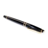 A Waterman fountain pen, stamped Paris in black and gilt coloured with pierced shaped clip, oval ins