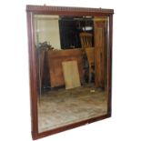 A large Edwardian framed hanging mirror, with gadrooned top, bevelled glass and carved frame, 137cm