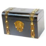 A 19thC ebonised domed top casket, set with circular sections with an elaborate escutcheon and plain