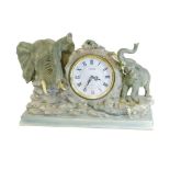 A Juliana novelty quartz clock, set with resin elephants, with a 13cm Dia. Roman numeric dial, 43cm