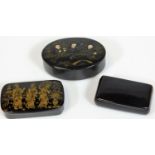 A late 19thC Japanned snuff box, with hinged lid set with figures, 8cm W and two further snuff boxe