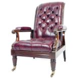 A 19thC mahogany framed library armchair, the button back seat and arms upholstered in red leather w