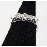 An 18ct white gold five stone diamond ring, set with five round brilliant cut diamonds, each in claw
