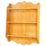 A set of pine open hanging shelves, with a carved top and three open shelves, 96cm H, 68cm W, 15cm D
