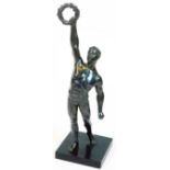 A 20thC Art Deco style spelter figure, of a Greek athlete in standing pose with arm aloft, holding g