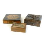 An early 20thC Prisoner of War straw work box and cover, set with building and trees, 5cm H, 21cm W,