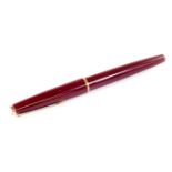 A Montblanc Classic fountain pen, in burgundy with gilt coloured clip and banding, with star to the