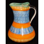A mid 20thC Myott & Sons pottery jug, of shaped form, decorated with a stripe pattern predominately