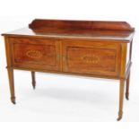 An Edwardian mahogany dressing table, of rectangular form, with double cupboard to the front, on squ