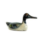 A painted pine folk art duck, probably French, in black white green and yellow colour way, possibly