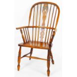 A early 20thC ash and elm high back Windsor chair, with pierced splat on double ring turned legs joi