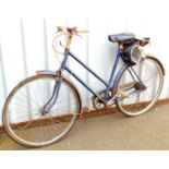 A vintage BSA ladies bicycle, with leather saddle, stapled bell and three gears, 100cm H.