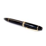 A Montblanc fountain pen no.149 Meisterstuck, black with gilt clip and banding, with star to the to