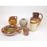 Various stoneware, a 19thC two coloured stoneware jug with beak spout and strap work handle, 29cm H,