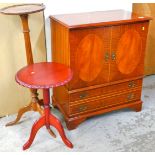 A TV cabinet, tripod jardiniere stand and a tripod table.