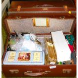 A pressed leather vintage travel case with various other contents.