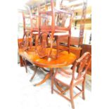 A mahogany D end dining table and six (6+2) Hepplewhite design shield back chairs. The upholstery in