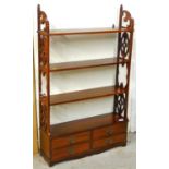 A 20thC mahogany hanging bookshelf, with four drawers beneath, each with plate back handles.