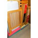 A child's single beech cot and two Christmas trees.