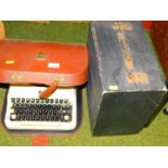 A cased Imperial Good Companion typewriter and various records in a single case.