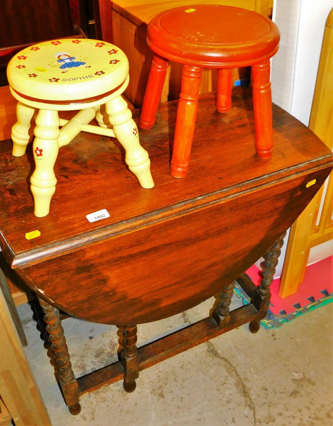 Two child's stools and an oak drop leaf table.