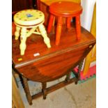 Two child's stools and an oak drop leaf table.