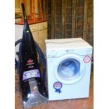 A White Knight 3.5kg tumble drier and a Bissell Porterwash Pro floor cleaner.