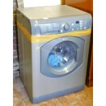 A Hotpoint Aquarius WDF740 7kg washer/ dryer.