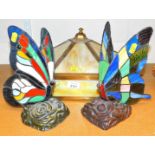 A Tiffany style lamp and two butterfly lamps.