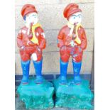 A pair of painted garden ornaments of figure smoking pipe. (2)