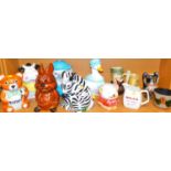 Novelty cookie jars, biscuit barrels, etc. duck, Bells Whisky jug, etc. (1 shelf)