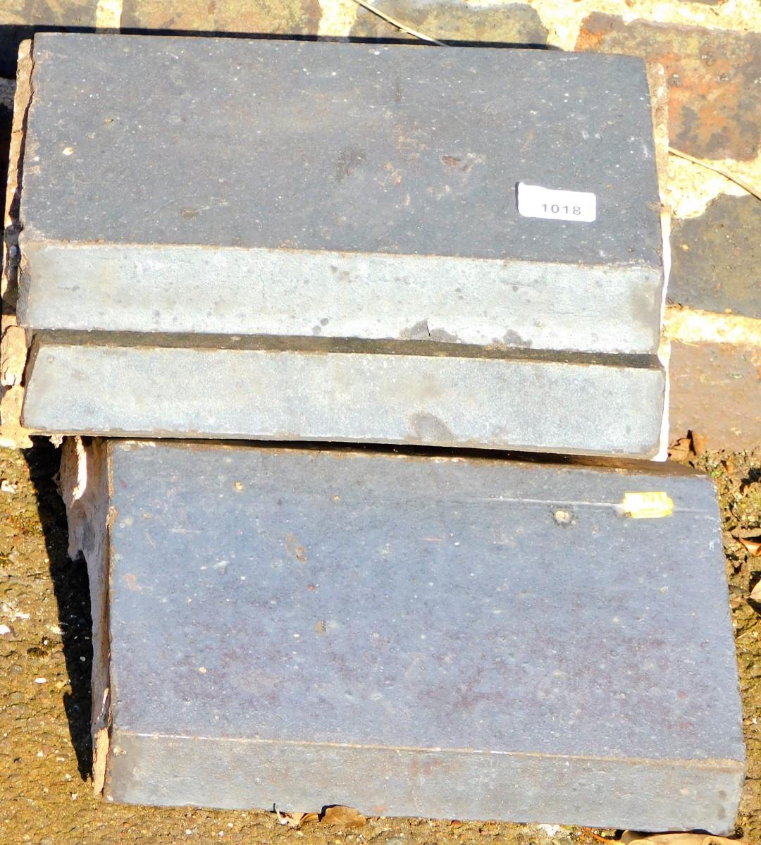 Three shaped coping stones.