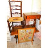 A ladder back chair, small sofa table, oak coffee table and an embroidered firescreen.