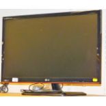An LG PSLED 24" colour TV, with wire and accessories.