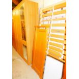 A bedroom pair, comprising three door wardrobe and matched bed, etc.