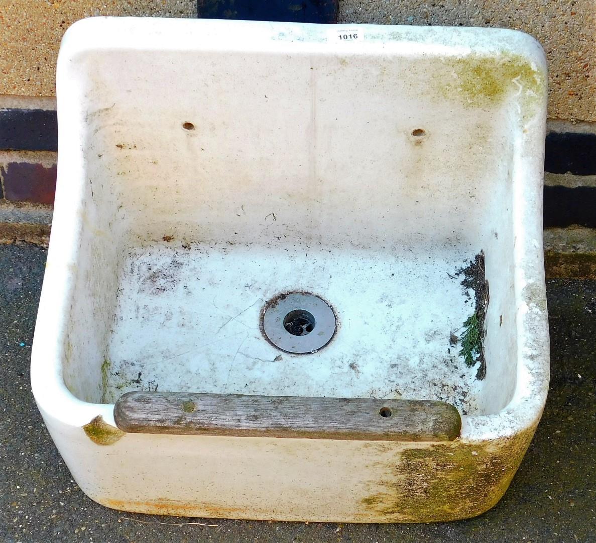 A white ceramic outdoor basin.