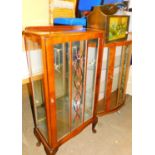 A newspaper rack, a display cabinet and another. (3)