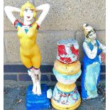 A painted garden ornament of a lady and another on plinth base. (2, AF)