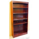 A mahogany finish freestanding open bookcase.