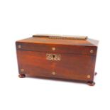 A Regency rosewood and mother of pearl inlay tea caddy, of sarcophagus form, the hinged lid