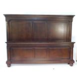 A Chinese chocolate hardwood kingsize head board and matching foot board, each of triple panelled