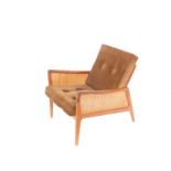 A Peter Hvidt and Olga Molgaard-Nielsen teak and cane lounge chair, circa 1950's, for France and